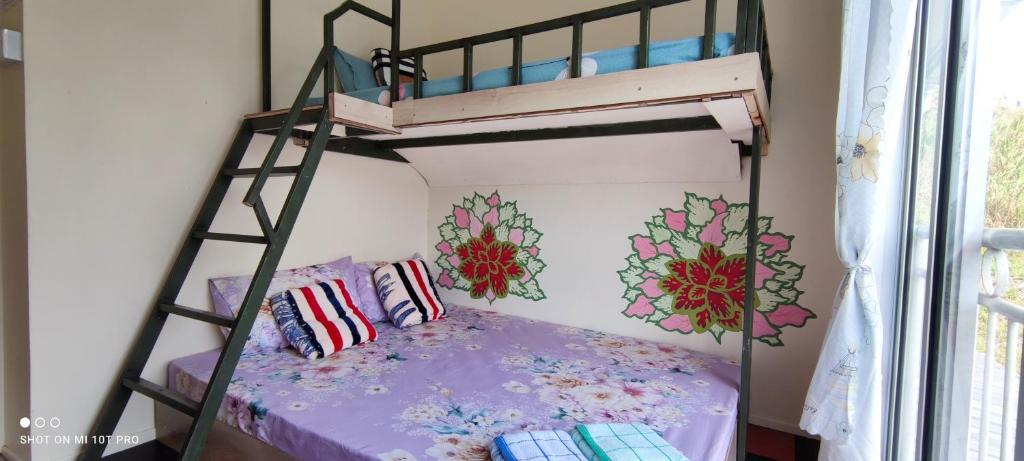 Letto o letti in una camera di Nulu View Cabin