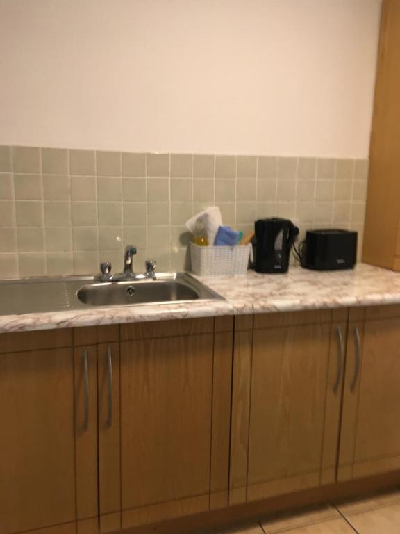 a kitchen with a sink and a counter top at Cheap Budget Accommodation in Galway