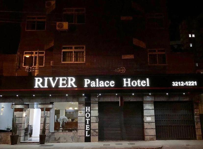 a river palace hotel is lit up at night at River Palace Hotel in Divinópolis