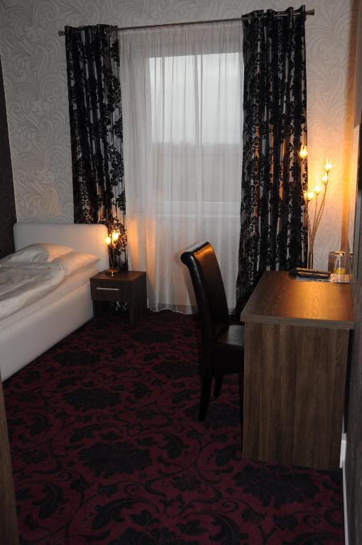 Postel nebo postele na pokoji v ubytování Restaurace a hotel Amerika