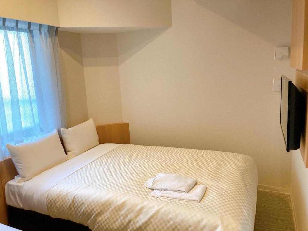 Postel nebo postele na pokoji v ubytování Nesthotel alt Kuramae Station
