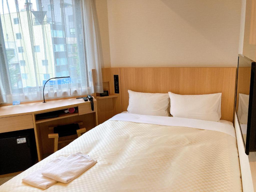Postel nebo postele na pokoji v ubytování Nesthotel alt Kuramae Station