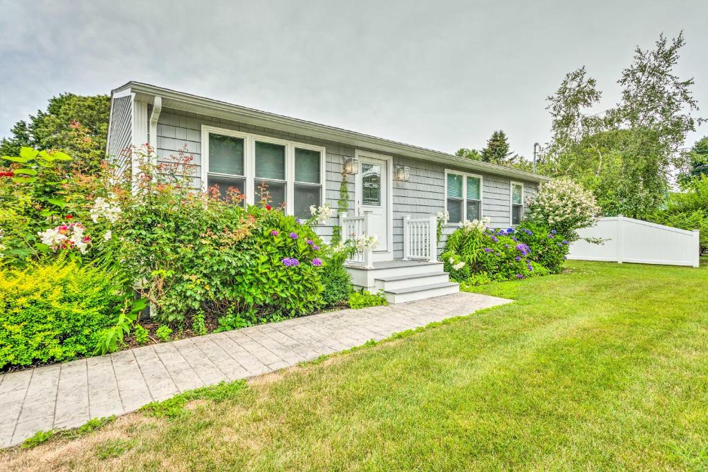 a house with a garden in front of it at Narragansett Escape by Narrow River and Beaches in Narragansett