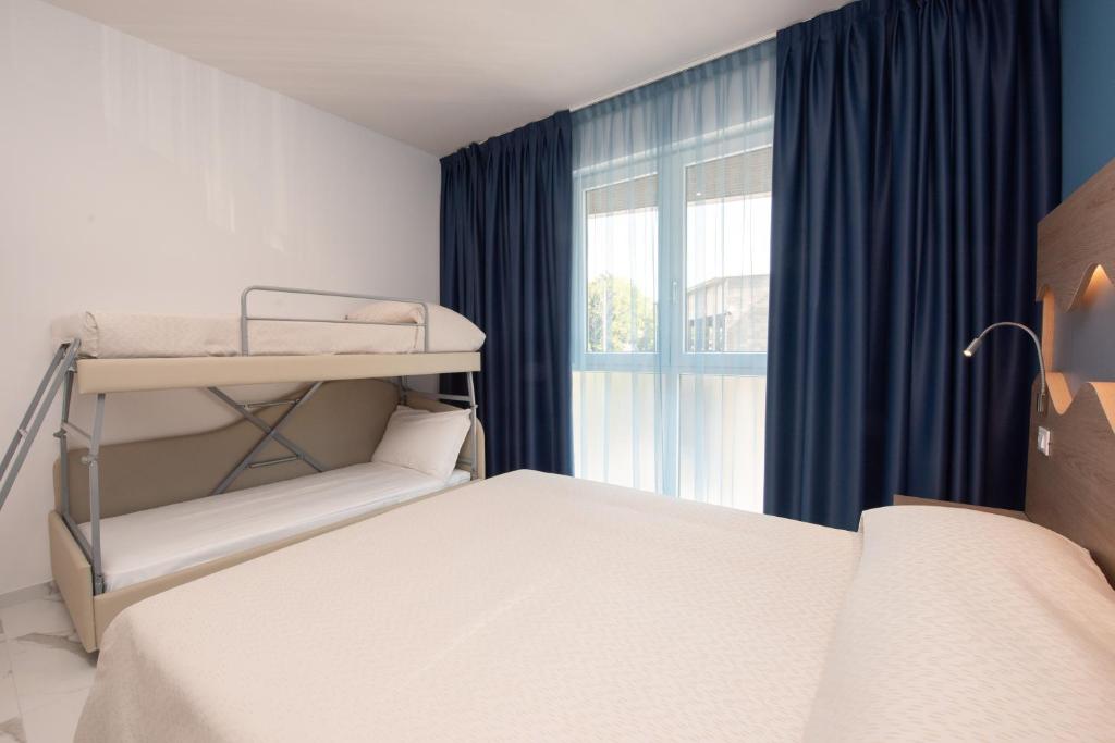 Postel nebo postele na pokoji v ubytování Hotel Marconi Express