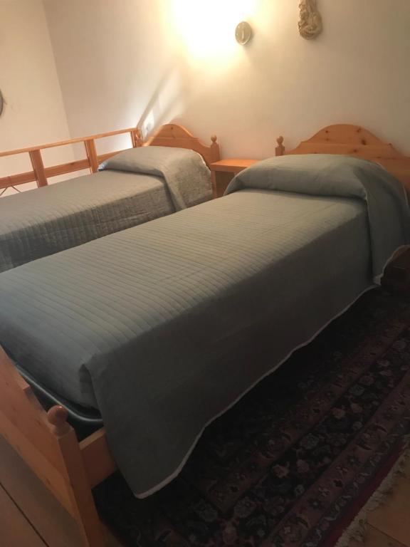 A bed or beds in a room at Villetta Romeo Casavacanze