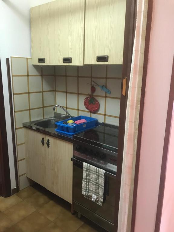 A kitchen or kitchenette at Villetta Romeo Casavacanze