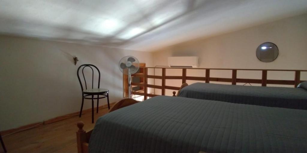 A bed or beds in a room at Villetta Romeo Casavacanze