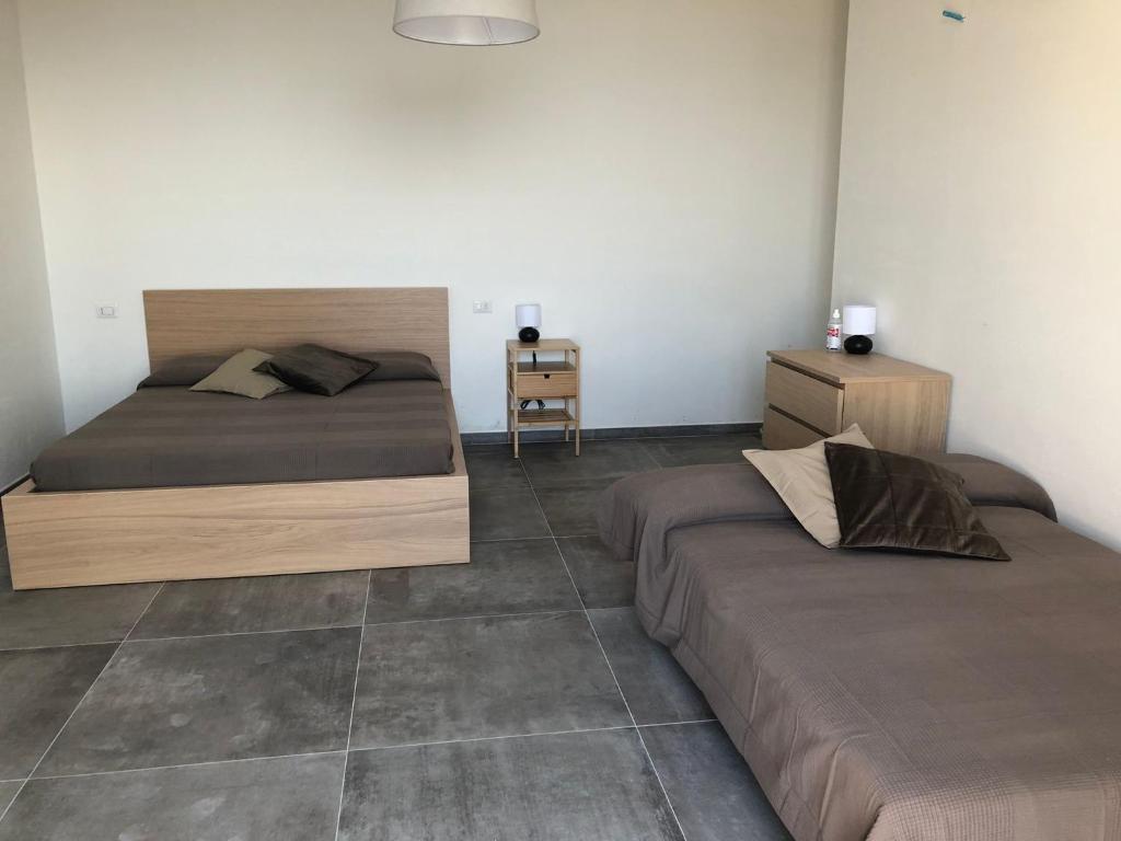 Postel nebo postele na pokoji v ubytování Verde Matematico