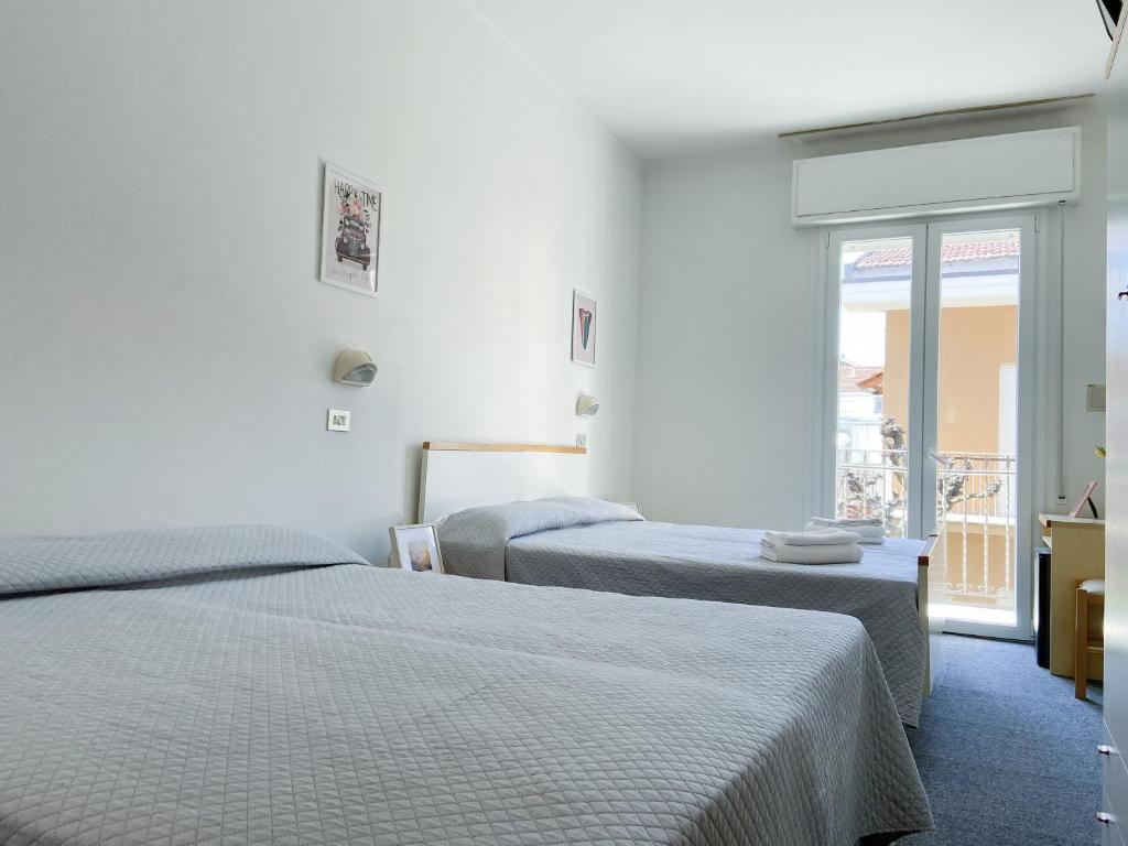 Postel nebo postele na pokoji v ubytování Hotel Berlino
