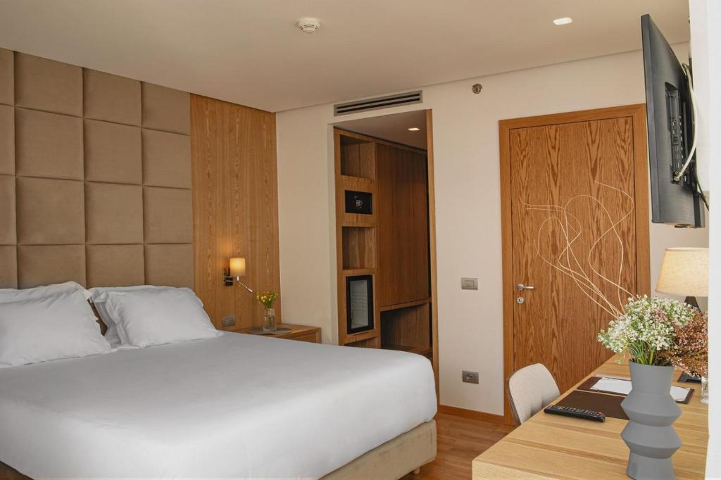 Postel nebo postele na pokoji v ubytování Amare Hotel