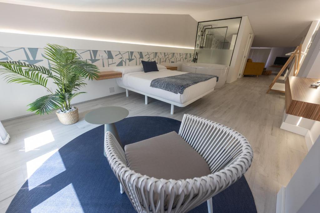 Postel nebo postele na pokoji v ubytování APARTAMENTOS CUME DO PINDO