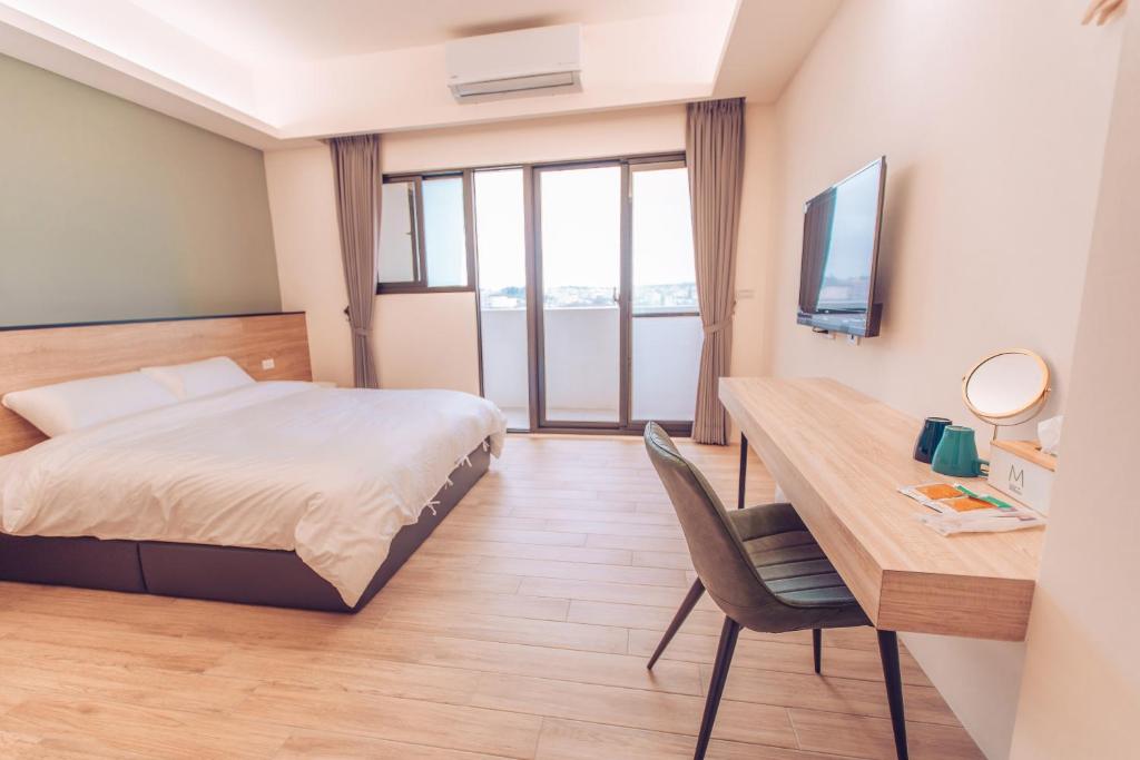 Postel nebo postele na pokoji v ubytování The Pai Hotel