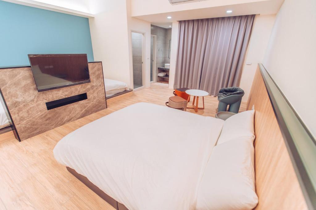 Postel nebo postele na pokoji v ubytování The Pai Hotel