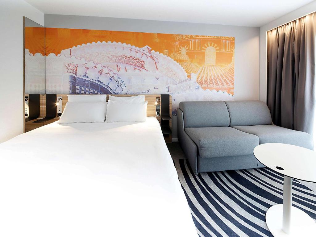 Postel nebo postele na pokoji v ubytování Novotel Clermont-Ferrand