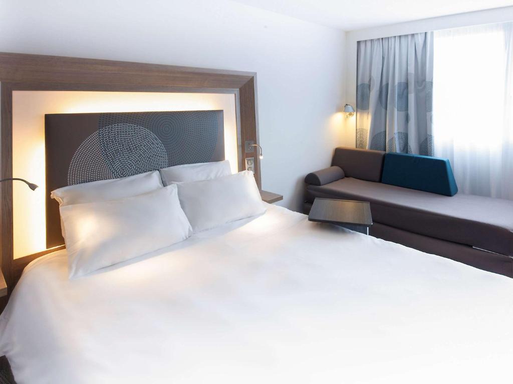 Postel nebo postele na pokoji v ubytování Novotel Clermont-Ferrand