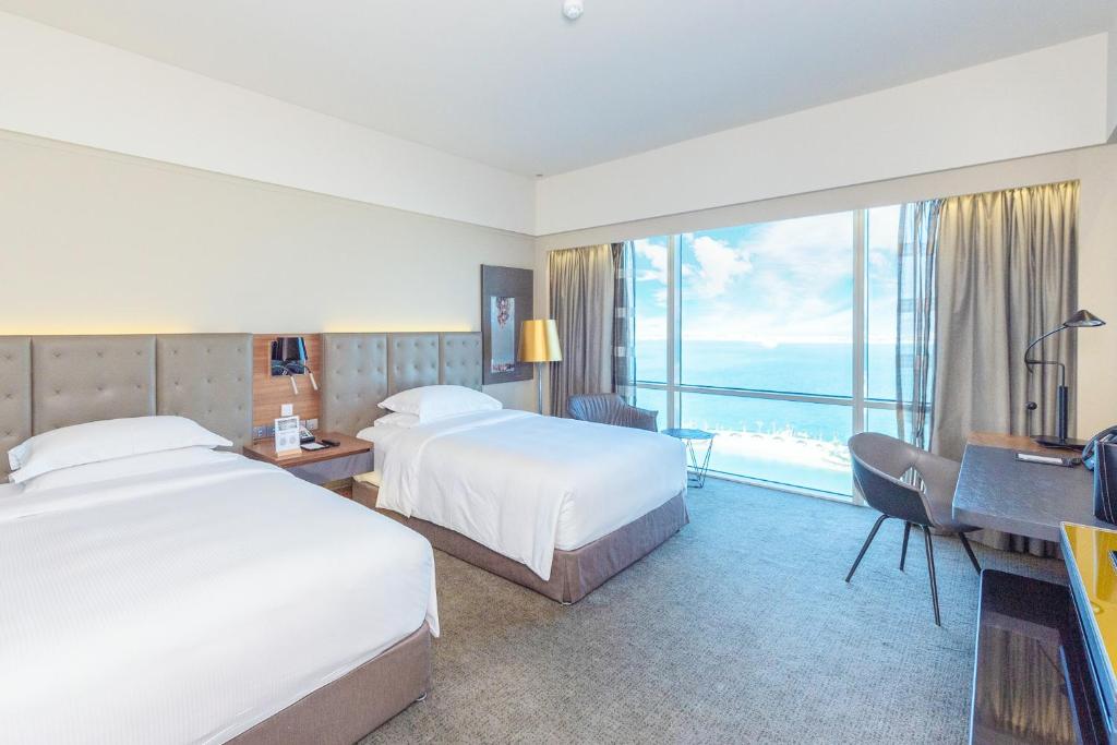 Кровать или кровати в номере The Art Hotel & Resort