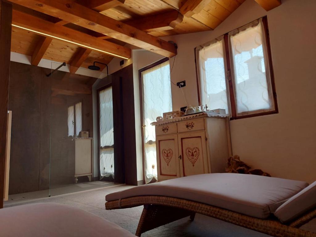 Postel nebo postele na pokoji v ubytování B&B Stella Alpina