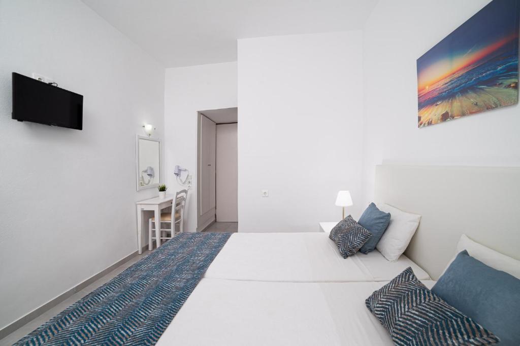 Postel nebo postele na pokoji v ubytování Roxani Hotel