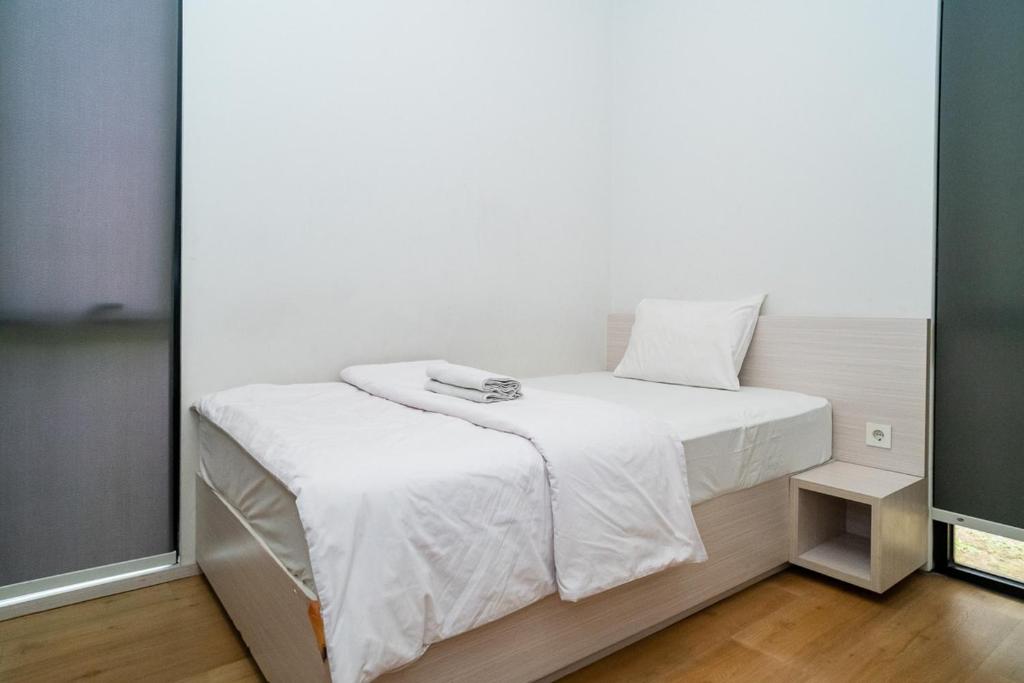 Postel nebo postele na pokoji v ubytování Three J Residence 2