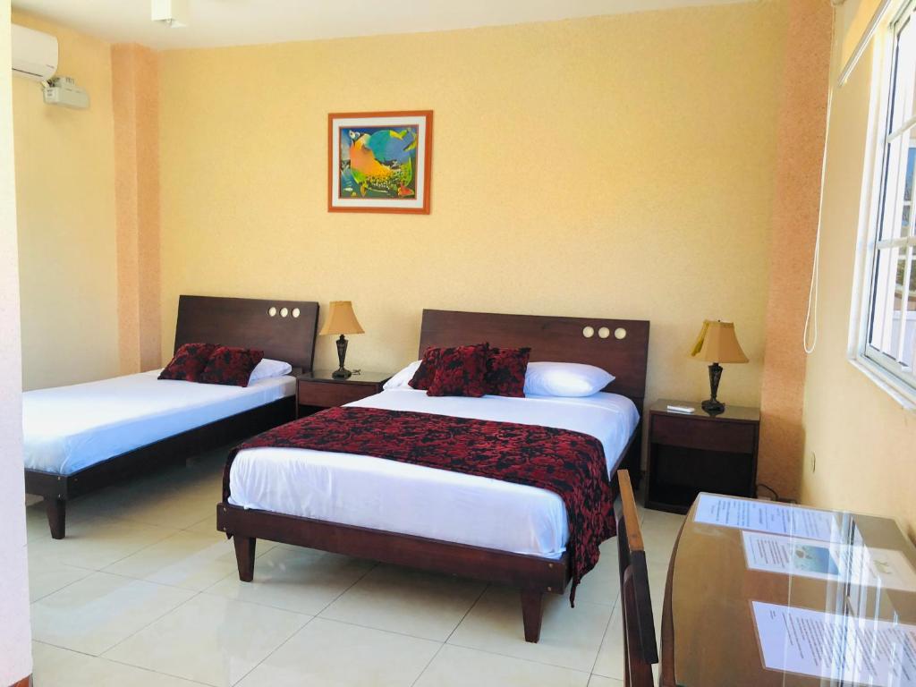 Postel nebo postele na pokoji v ubytování Eco Hotel Katarma