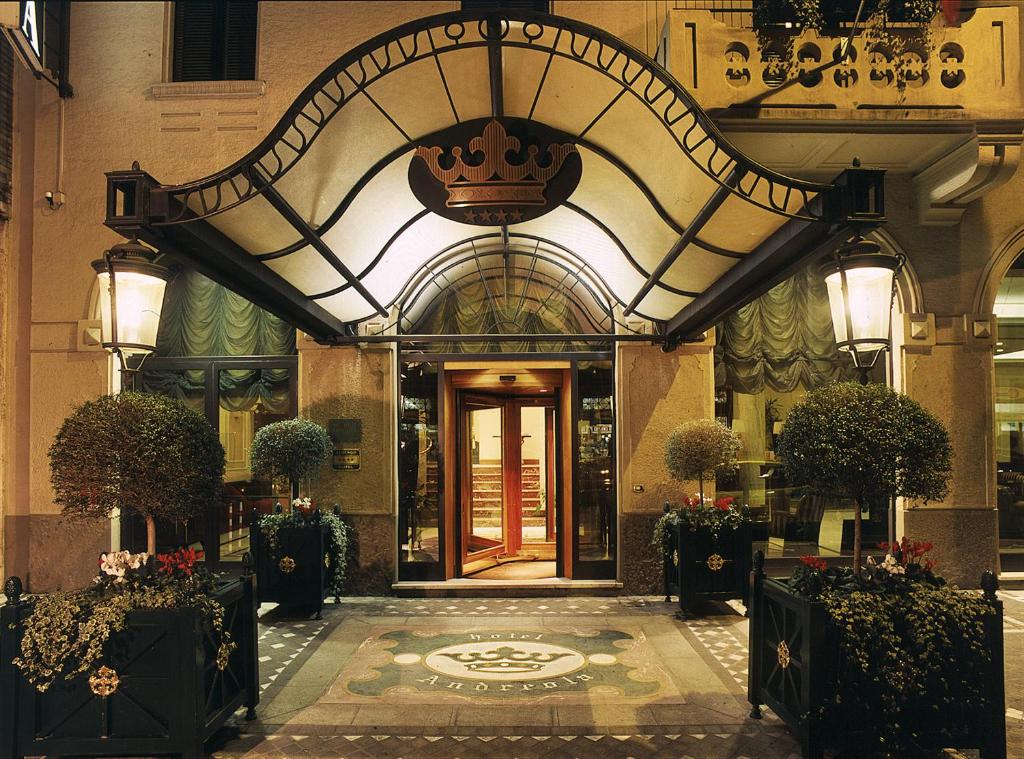an entrance to a building with a large doorway at Andreola Central Hotel in Milan