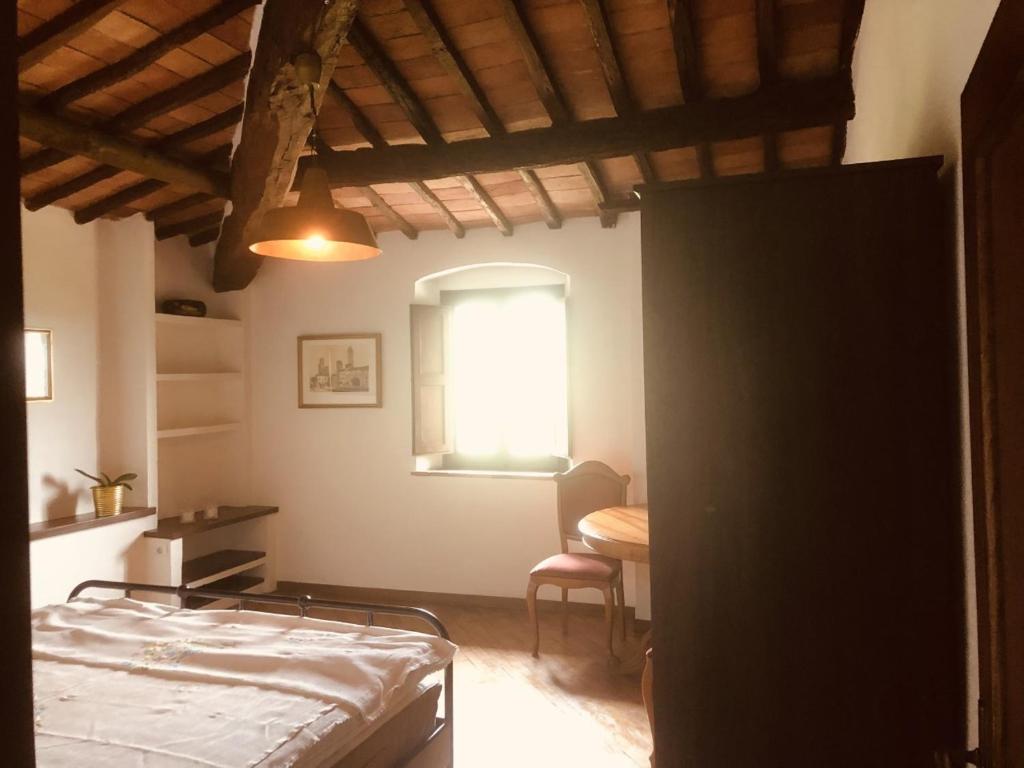 A bed or beds in a room at MEA CASA Toscana