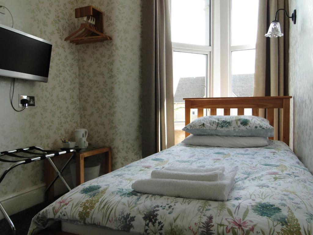 Postel nebo postele na pokoji v ubytování Rockleaze Guesthouse