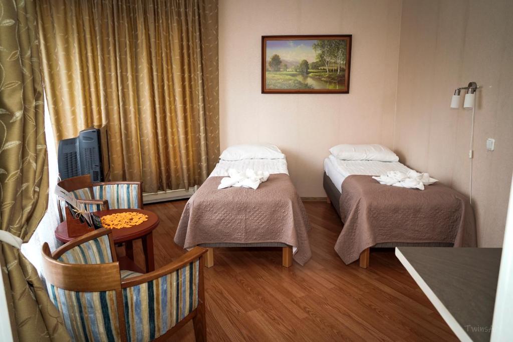 Postel nebo postele na pokoji v ubytování Humala Guest House