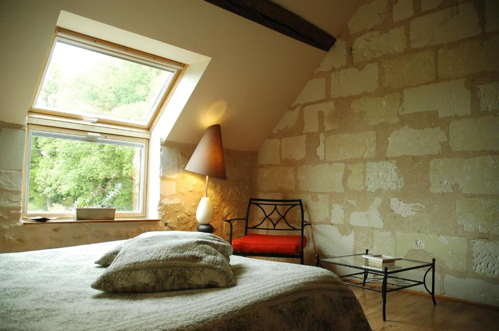 Postel nebo postele na pokoji v ubytování Les Pierres D'aurèle Chambres d'Hôtes