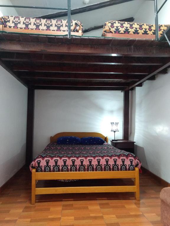 Letto o letti in una camera di Chelitos Backpacker
