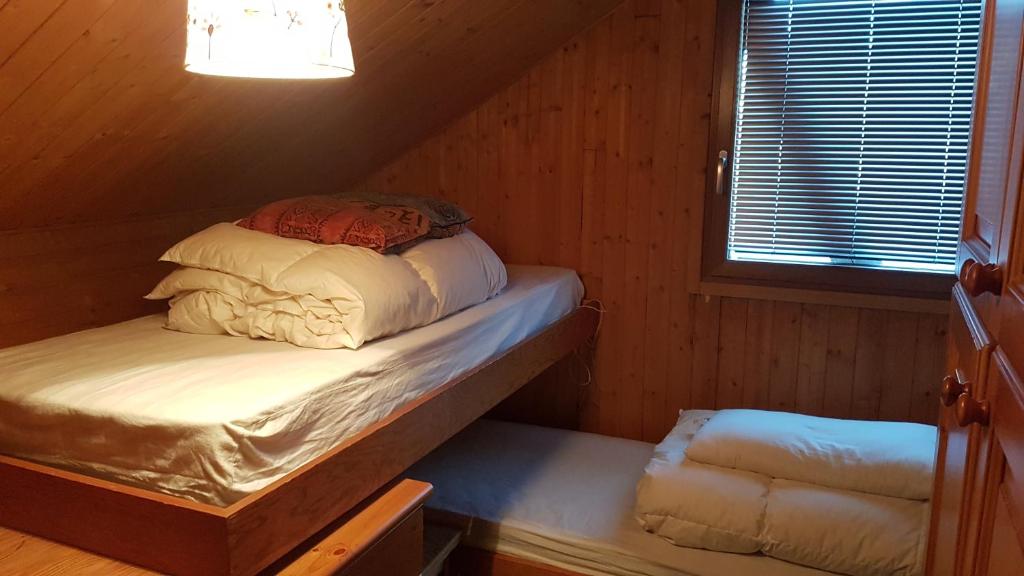 Voodi või voodid majutusasutuse Le Chalet n 0082 toas
