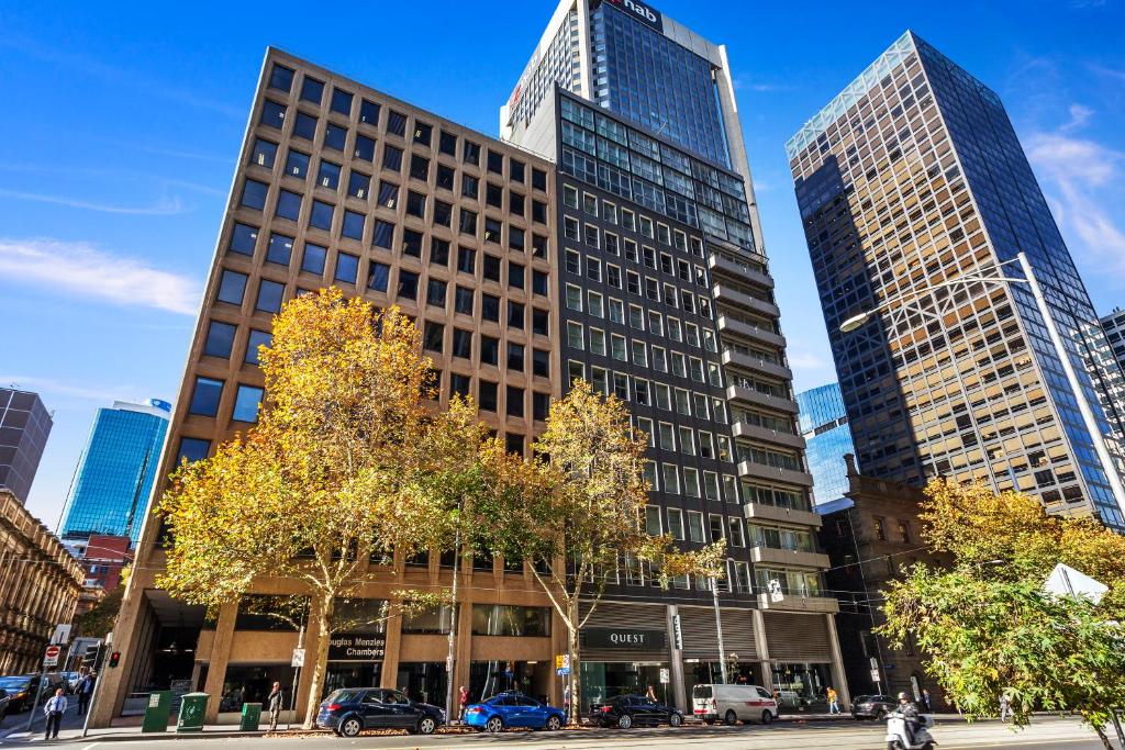 a group of tall buildings in a city at Quest on William in Melbourne