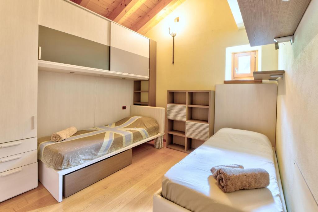 Postel nebo postele na pokoji v ubytování chalet con piscina e vista panoramica