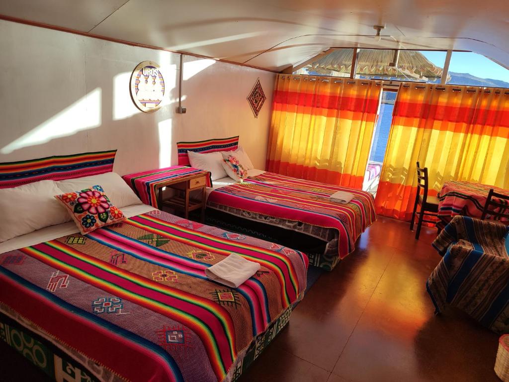 Postel nebo postele na pokoji v ubytování Titicaca Aruntawi Lodge Peru