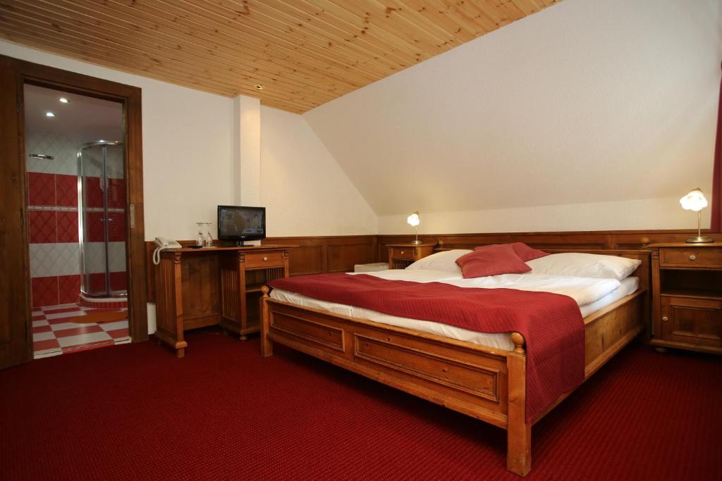 Postel nebo postele na pokoji v ubytování Hotel Jelinek