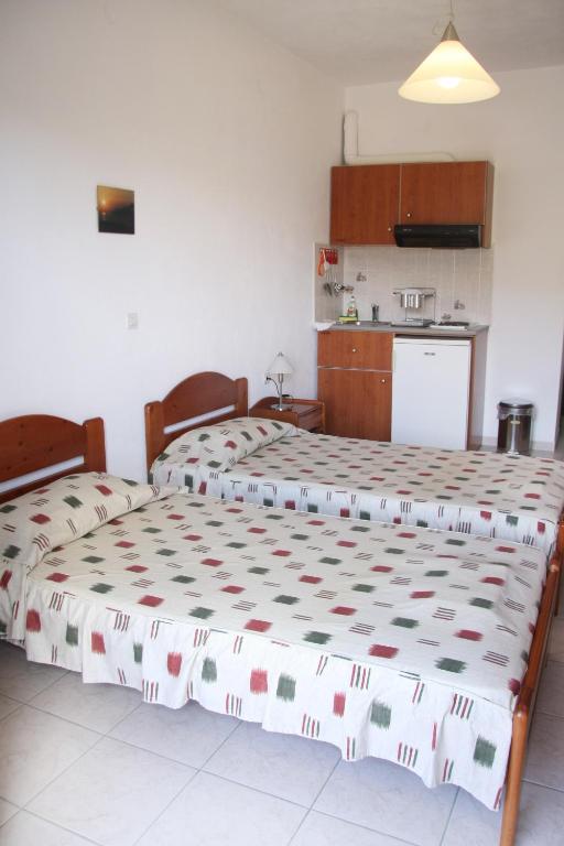 Łóżko lub łóżka w pokoju w obiekcie Evon's Rooms