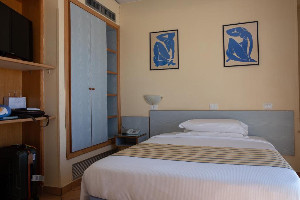 Postel nebo postele na pokoji v ubytování Hotel Ping Pong