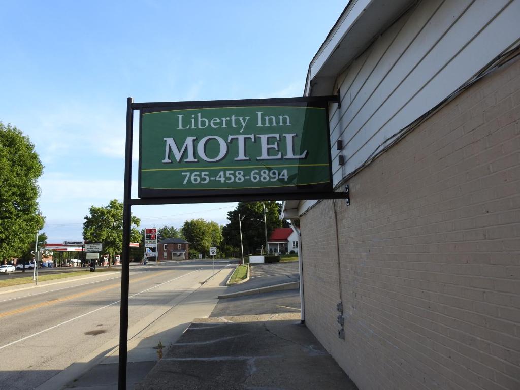 a sign for a motel on the side of a building at Liberty Motel in Liberty