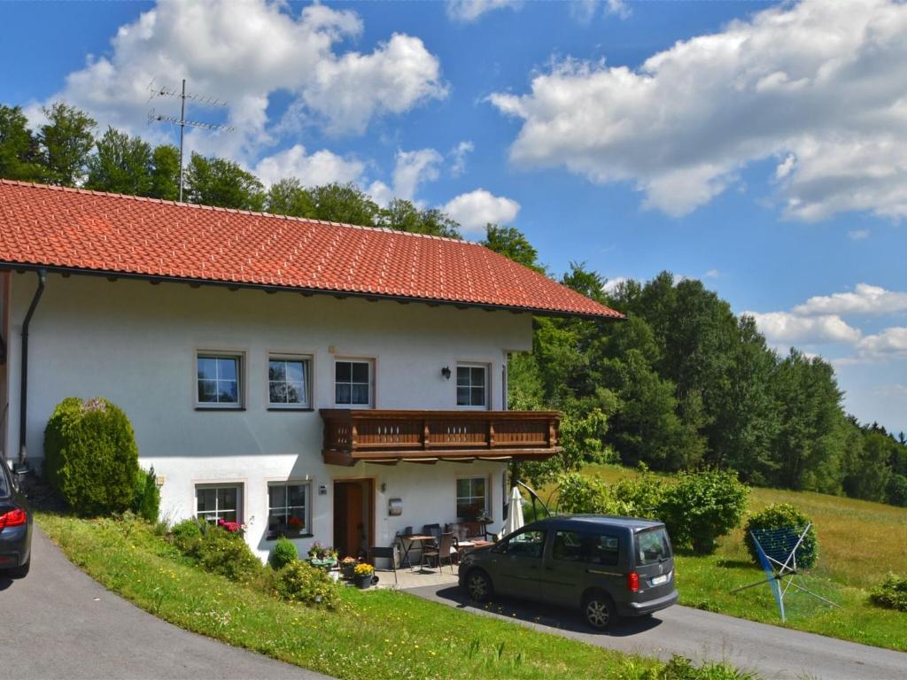 a car parked in front of a house at Apartment in the Bavarian Forest in Zenting
