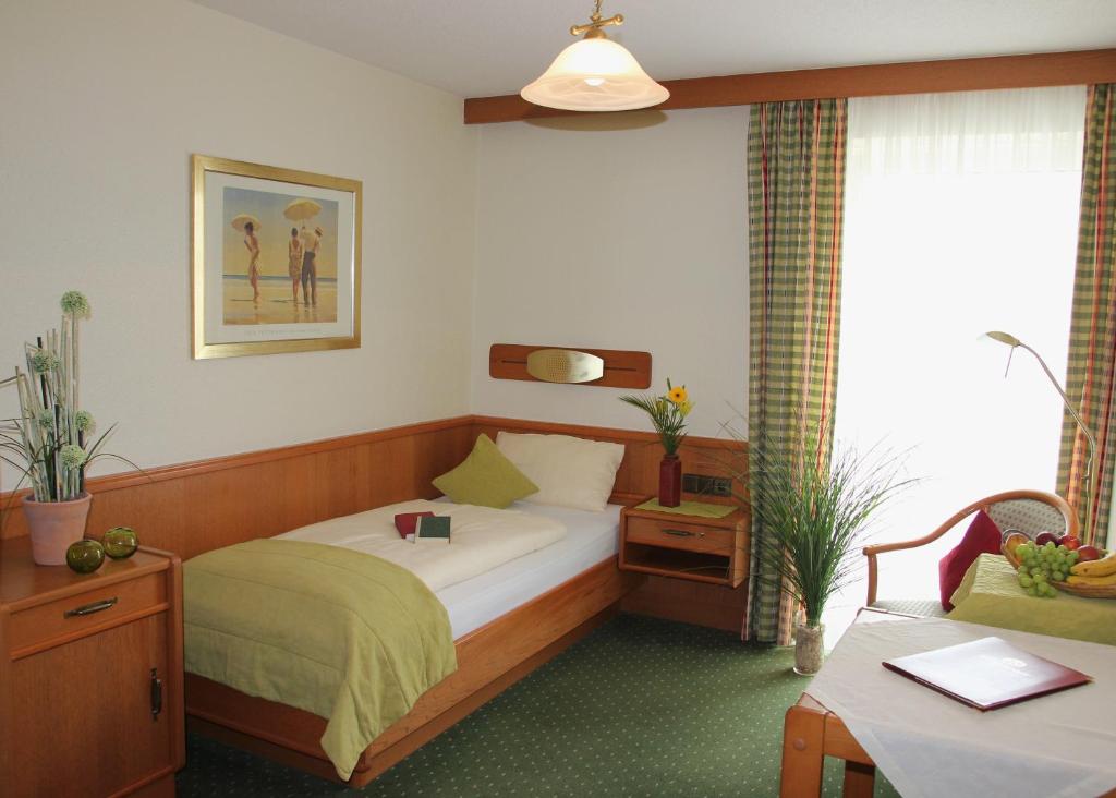 Postel nebo postele na pokoji v ubytování Apart-Hotel Pension Roßmayer