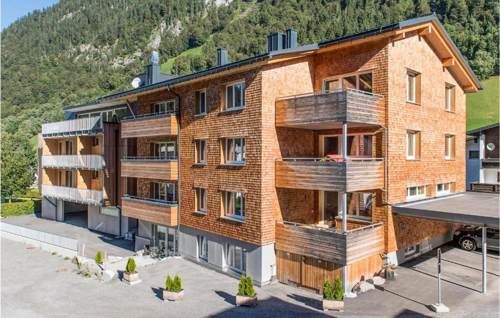 una vista aerea di un grande edificio in mattoni di Nice Apartment In Klsterle With Sauna And Wifi a Klösterle am Arlberg