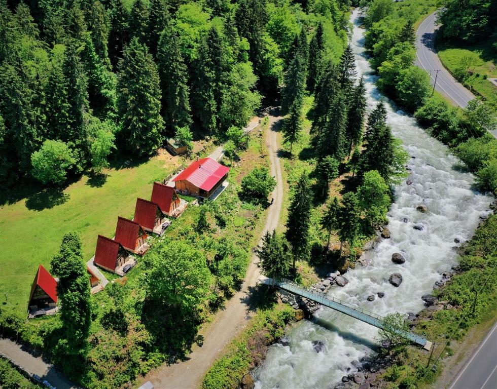 an aerial view of a train and a river at KOTİT AYDER in Ayder Yaylasi