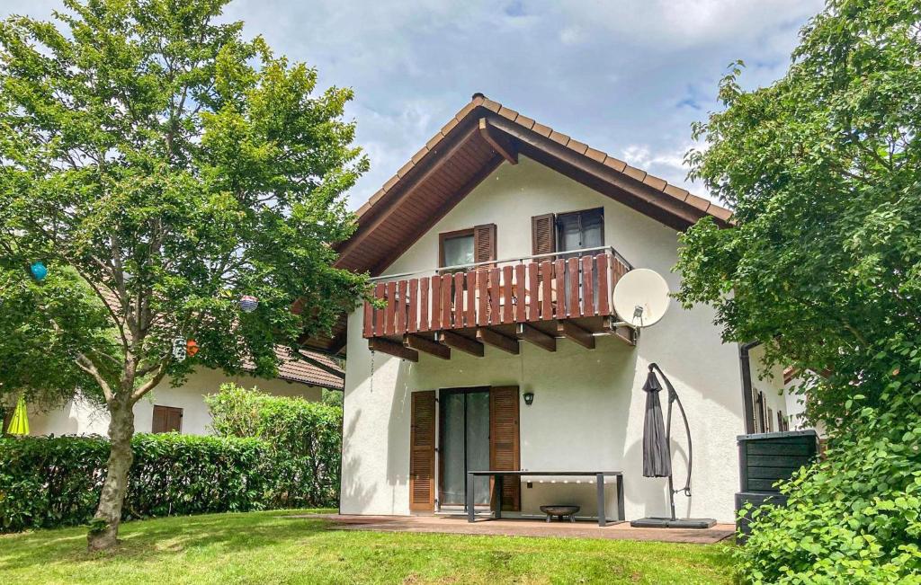 a house with a balcony on top of it at Ferienhaus 16 In Kirchheim in Kirchheim