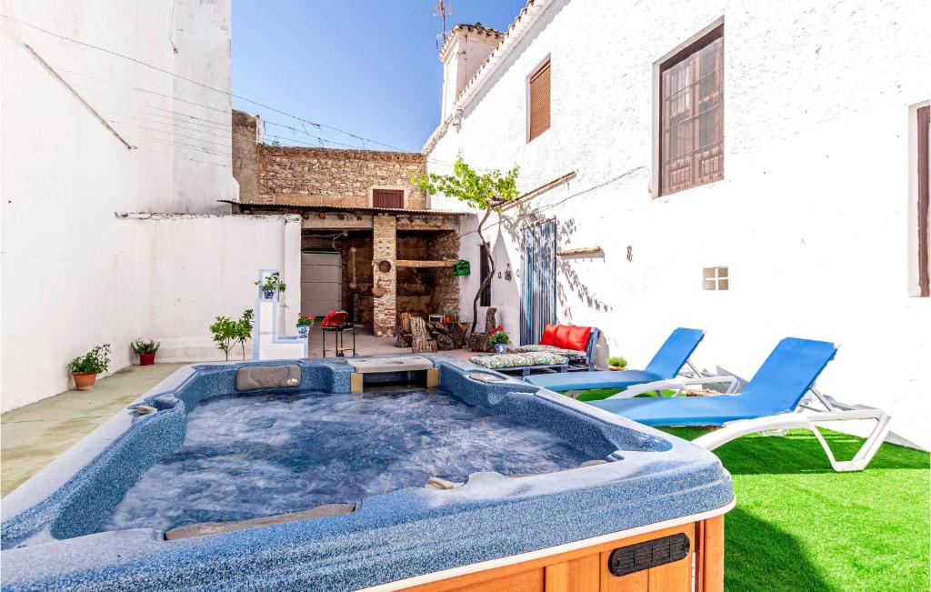 a hot tub in the backyard of a house at Stunning Home In Padul With Kitchen in Padul