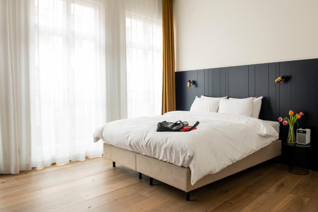 Postel nebo postele na pokoji v ubytování Hotel Riga