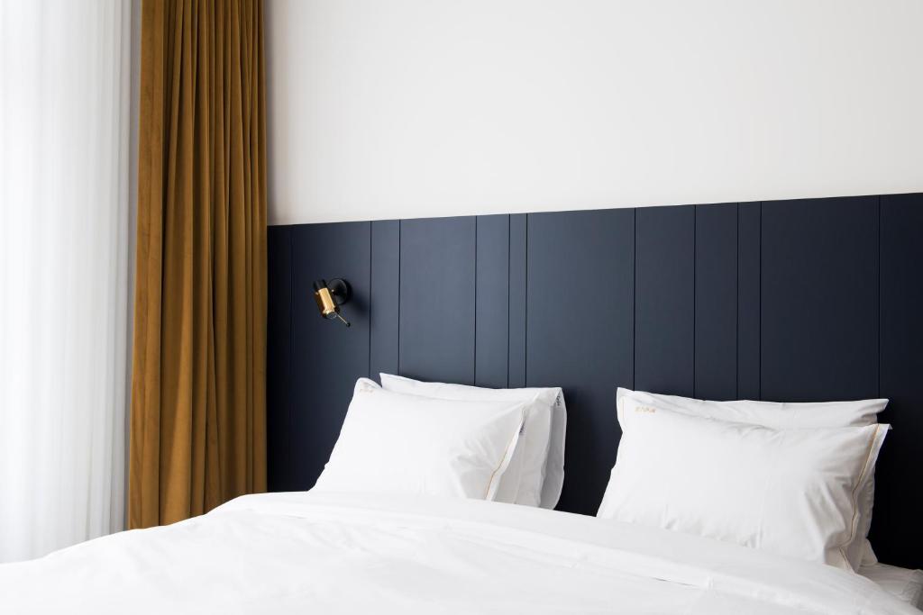 Postel nebo postele na pokoji v ubytování Hotel Riga
