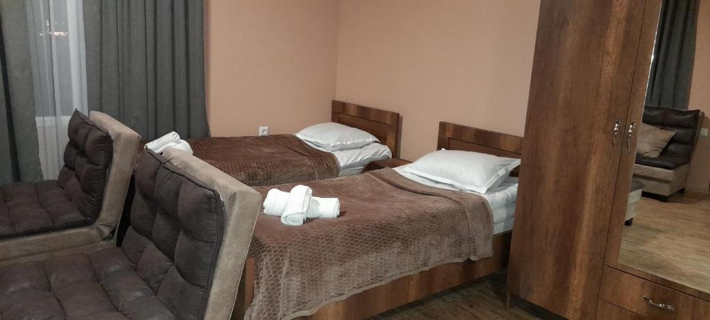 Postel nebo postele na pokoji v ubytování Lela Guest House