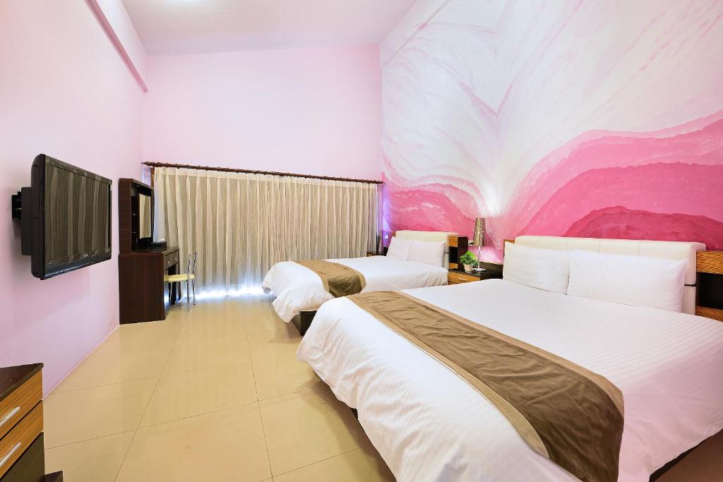 Vuode tai vuoteita majoituspaikassa Da Jen Shan Style Resort