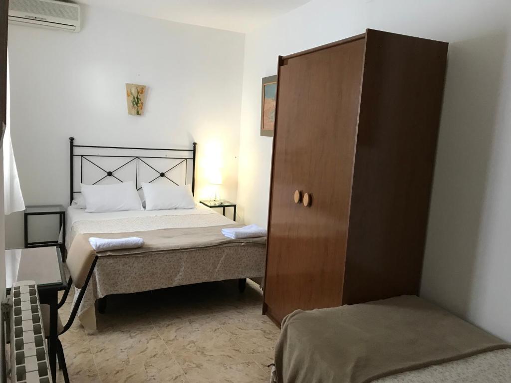 Cama o camas de una habitación en Pension el Portillo