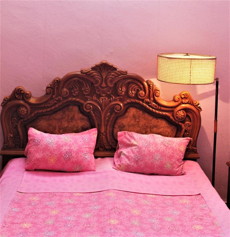 Postel nebo postele na pokoji v ubytování Guesthouse Medea on Pushkini 4